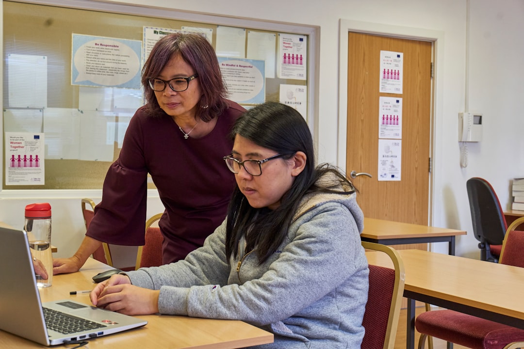 A person sitting at a desk in a workplace setting