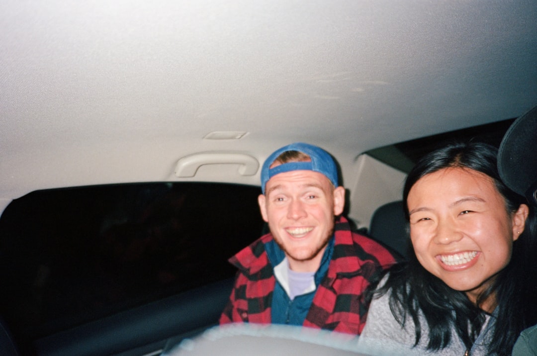 A participant and support worker travelling together by car